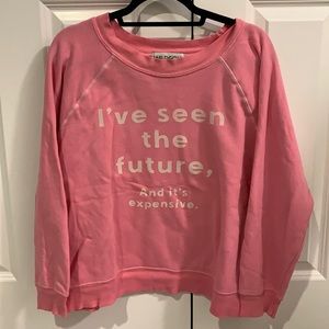Pink Wildfox boat neck sweatshirt with saying on the front